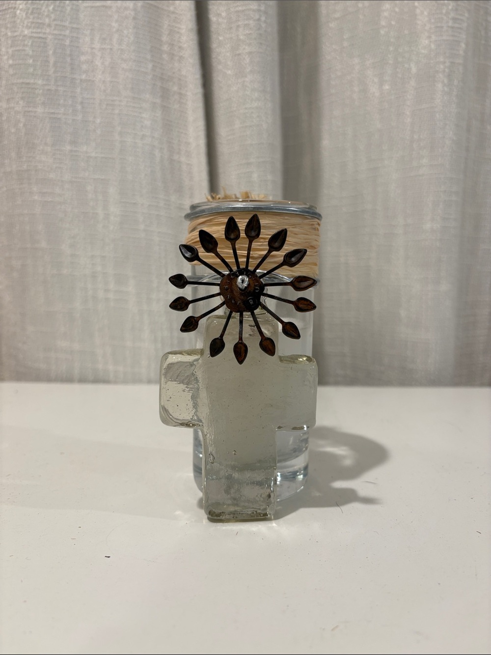 Jan Barboglio Clear Glass Cross candle holder with Brown Metal Sunburst Accent